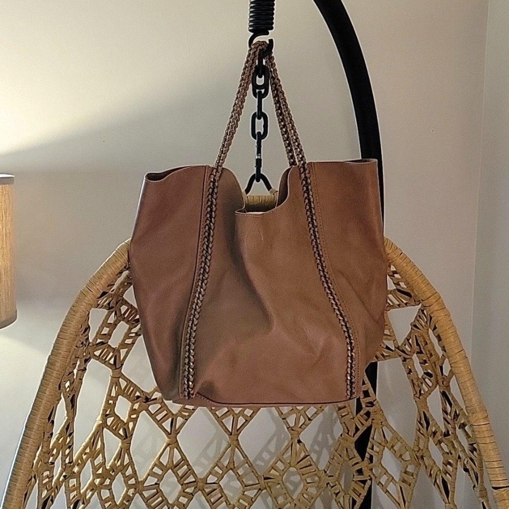 Large brown faux leather bag.